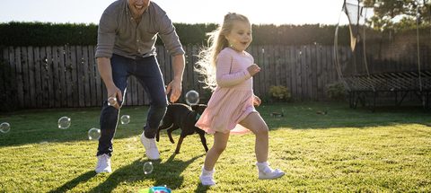 Man girl dog and bubbles